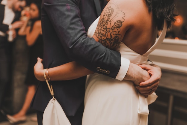 Bride and groom hugging at a wedding