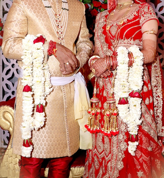 The bride and groom at the Indian wedding garlands or Jaimala ceremony