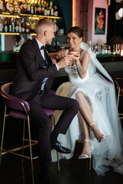 Bride and groom inside a cocktail bar