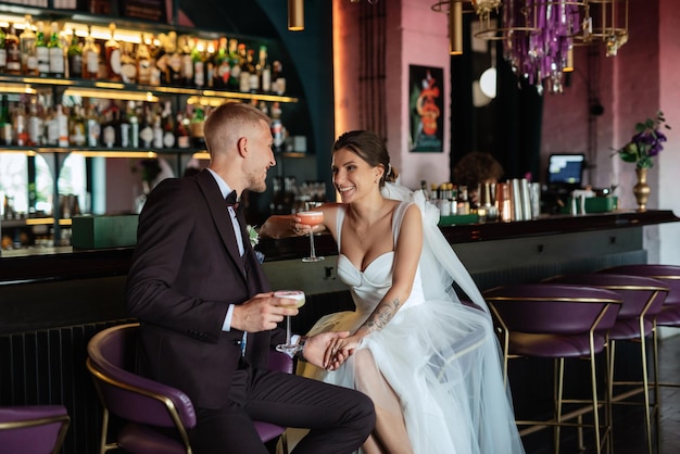 Bride and groom inside a cocktail bar