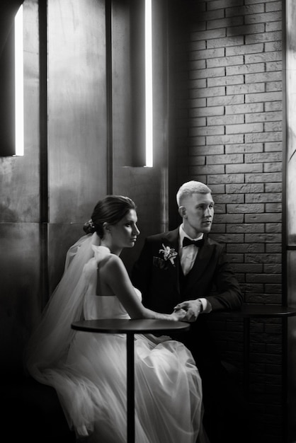 Bride and groom inside a cocktail bar