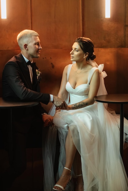 Bride and groom inside a cocktail bar