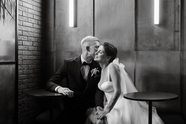 Bride and groom inside a cocktail bar