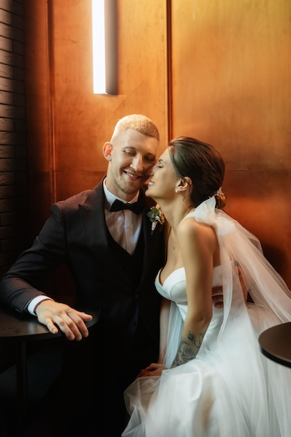 Bride and groom inside a cocktail bar