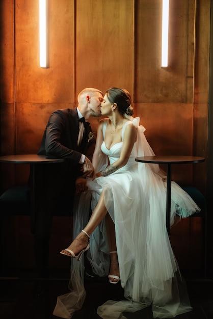 Bride and groom inside a cocktail bar