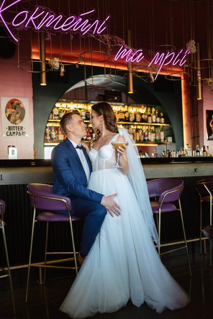 Bride and groom inside a cocktail bar