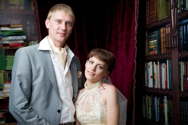 The bride and groom in an interior of the restaurant