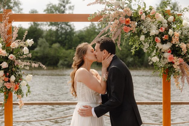 the bride and groom kiss