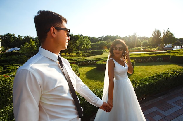 Bride and groom kisses tenderly in the shadow of a flying veil Together Wedding Love