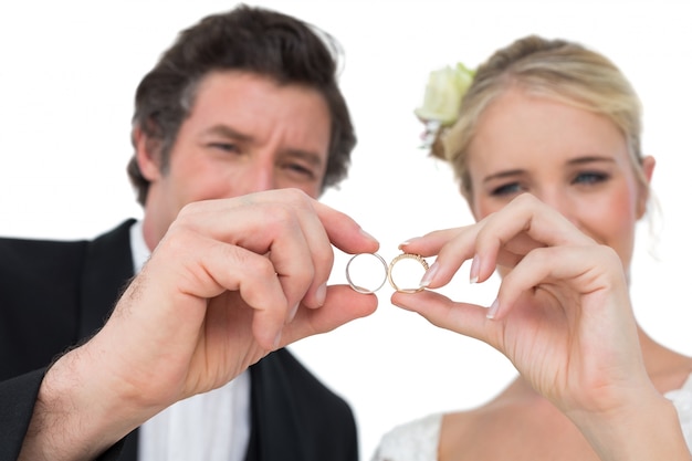 Bride and groom looking at wedding rings