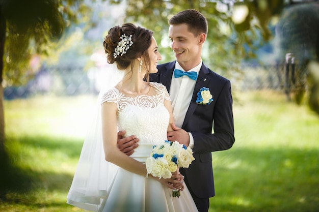 The bride and groom in nature Walk the newlyweds Wedding day The best day of a young couple