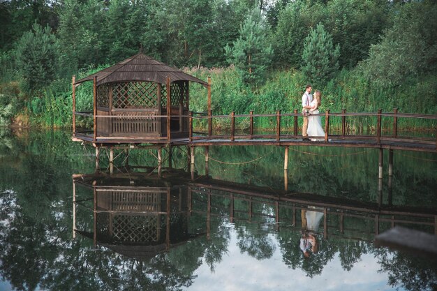 Bride and groom near lake