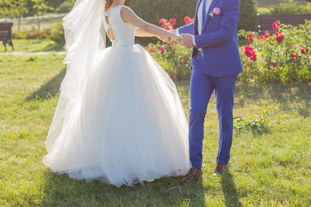 Bride and groom in a park among the trees