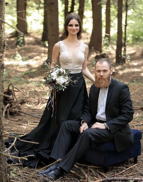 bride and groom in a pine forest.