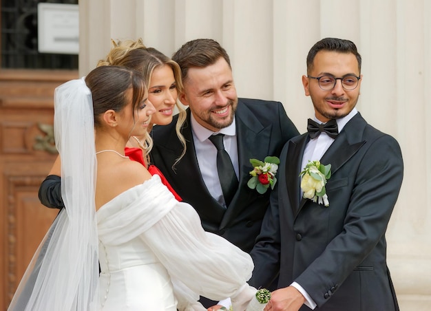 a bride and groom pose for a photo with the bride and groom