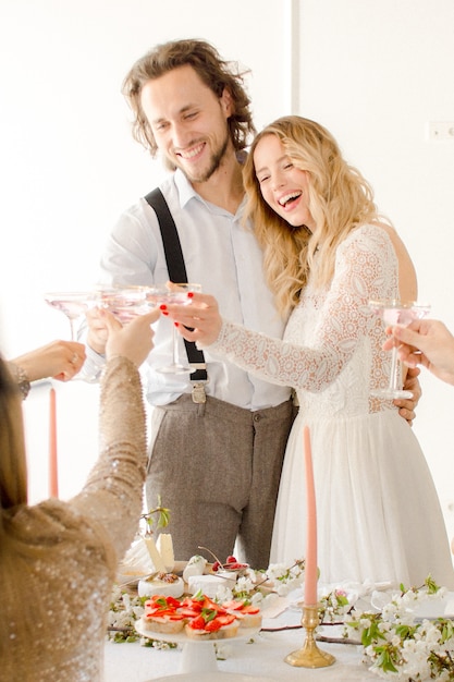 Bride and groom posing celebrating the wedding