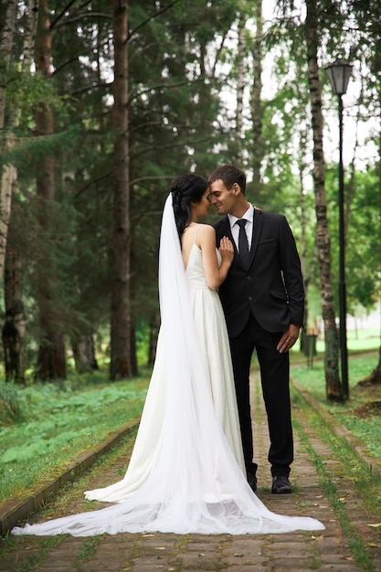 Bride and groom posing in nature