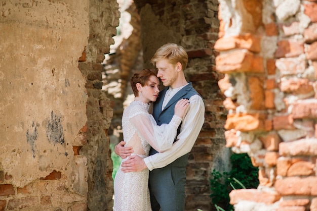 Bride and groom posing outdoors