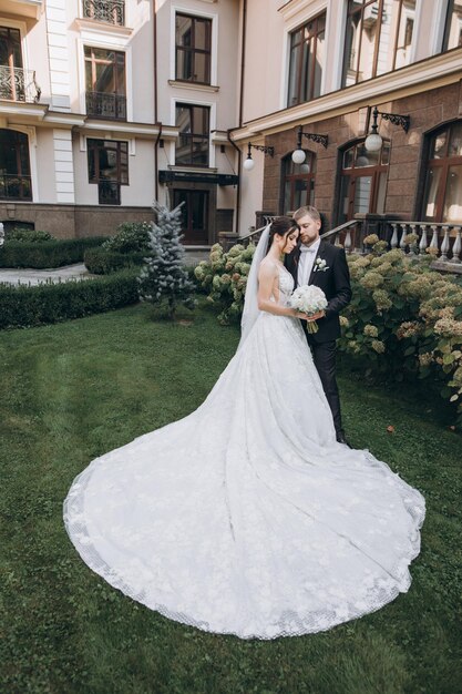 bride and groom stand in the garden