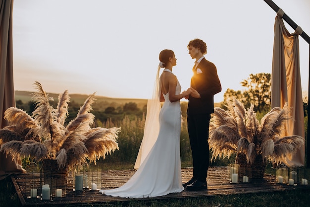 Photo bride and groom on their wedding ceremony