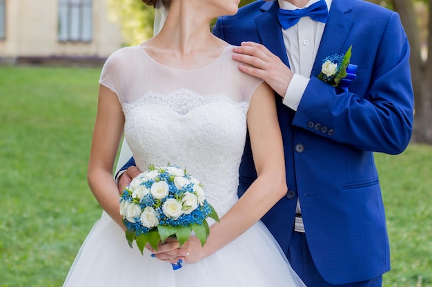 Bride and groom together in the park