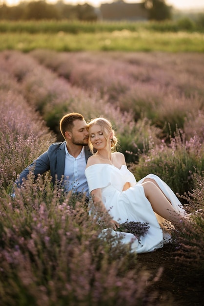 Bride and groom on a walk in the lavender field