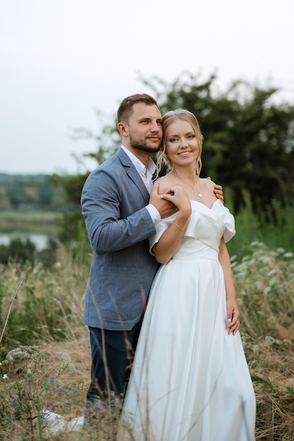 Bride and groom on a walk in the woods