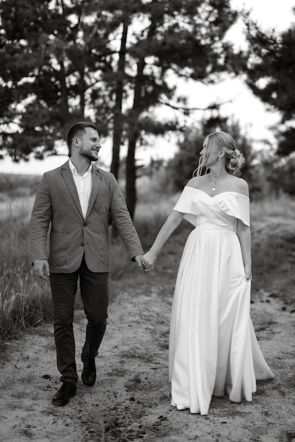 Bride and groom on a walk in the woods