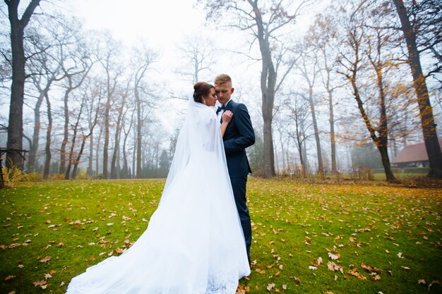 Bride and groom walking outdoors