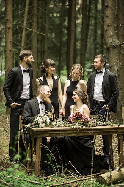 Bride and groom at the wedding ceremony in the woods