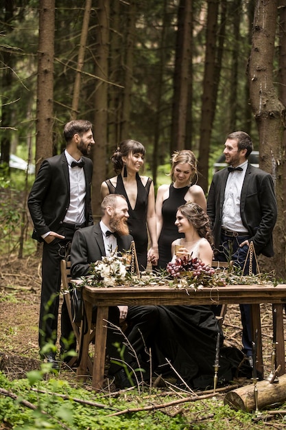 Bride and groom at the wedding ceremony in the woods