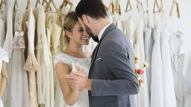 Bride and groom in wedding dress prepare ceremony.