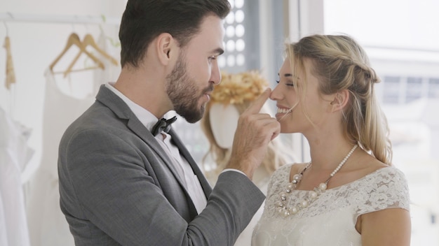 Bride and groom in wedding dress prepare ceremony.