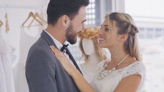 Bride and groom in wedding dress prepare ceremony.