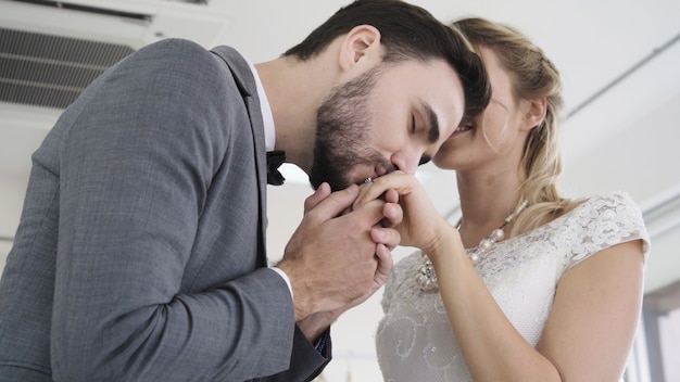 Bride and groom in wedding dress prepare ceremony.