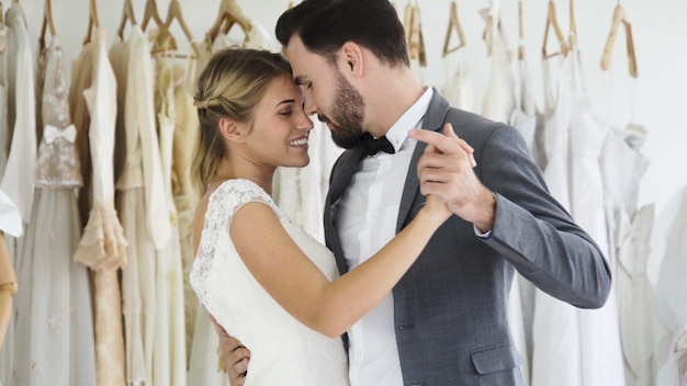 Bride and groom in wedding dress prepare ceremony.