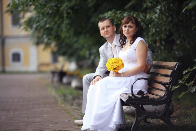 bride and groom wedding walk in park in summer