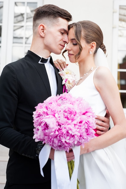 Bride and groom with wedding bouquet