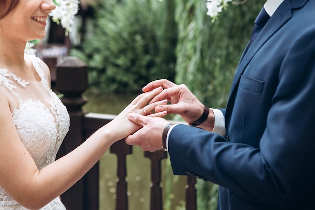 The bride and groom with wedding rings