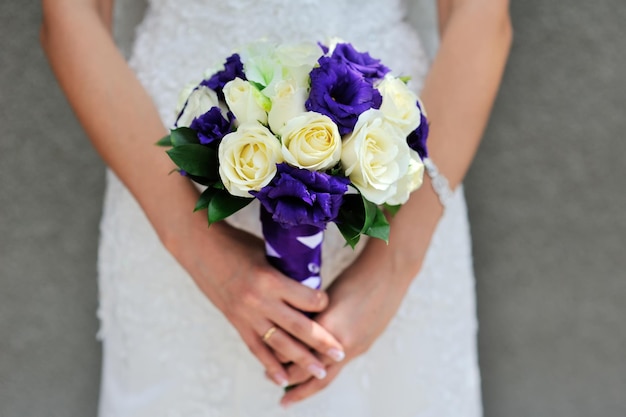 Bride hold beautiful wedding bouquet