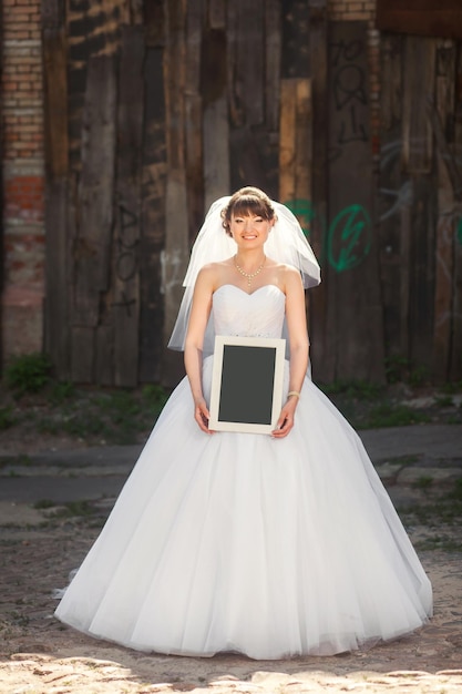 Bride holding blank placard for any title