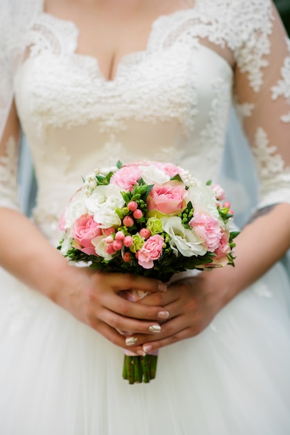 Bride holding bouquet in hands