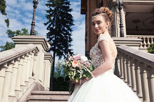 Bride holding wedding bouquet of flowers