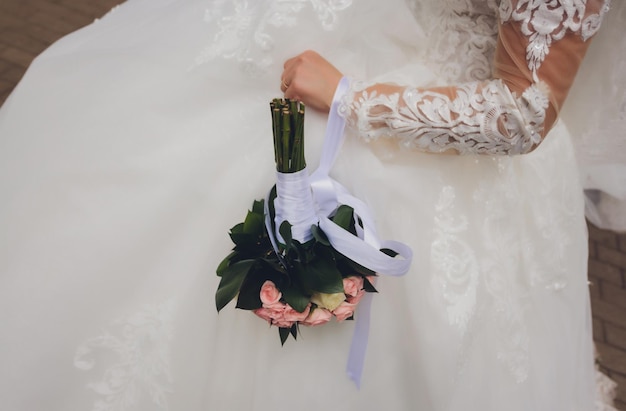 Bride is holding a beautiful wedding bouquet