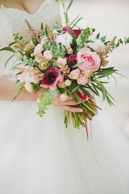 The bride is holding a bouquet of flowers 5730