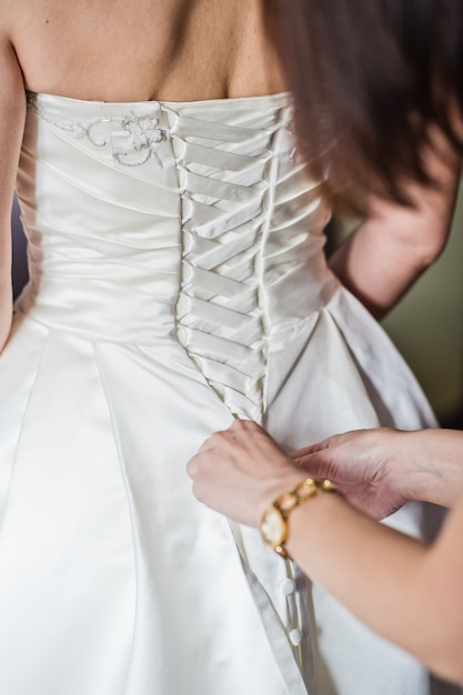 The bride is wearing a luxurious wedding dress