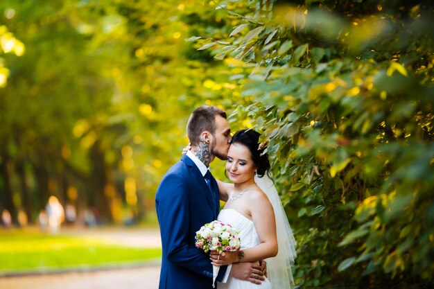 The bride kisses the bride gently