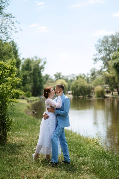 Bride in a light wedding dress to the groom in a blue suit