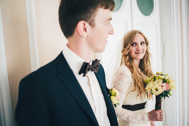 Bride looks at groom on wedding day