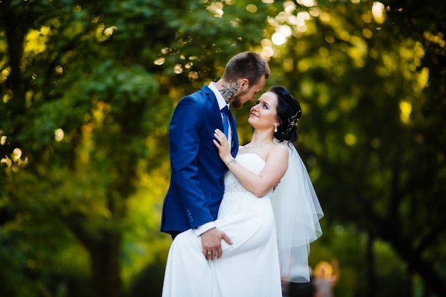 The bride passionately embraces his beloved